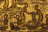 Luang Prabang, Laos - Wat Mai the gilded stucco engravings of the veranda. They narrate the Vessantara Jataka with scenes of everyday life.